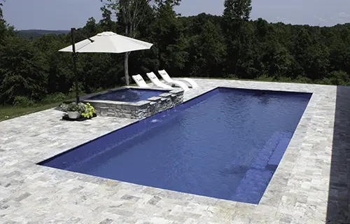 Leisure Pools The Grand rectangular fiberglass composite pool for lounging, installed by Leisure Pools Northern Kentucky